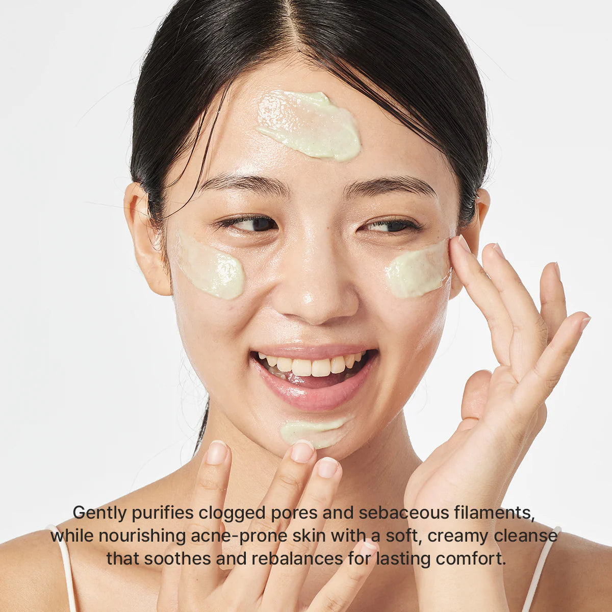 Woman applying a facial mask with text about skincare benefits on a white background