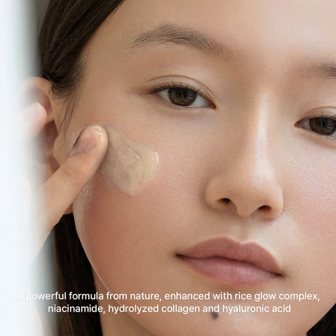 Close-up of a person applying cream to their face with text about product ingredients.
