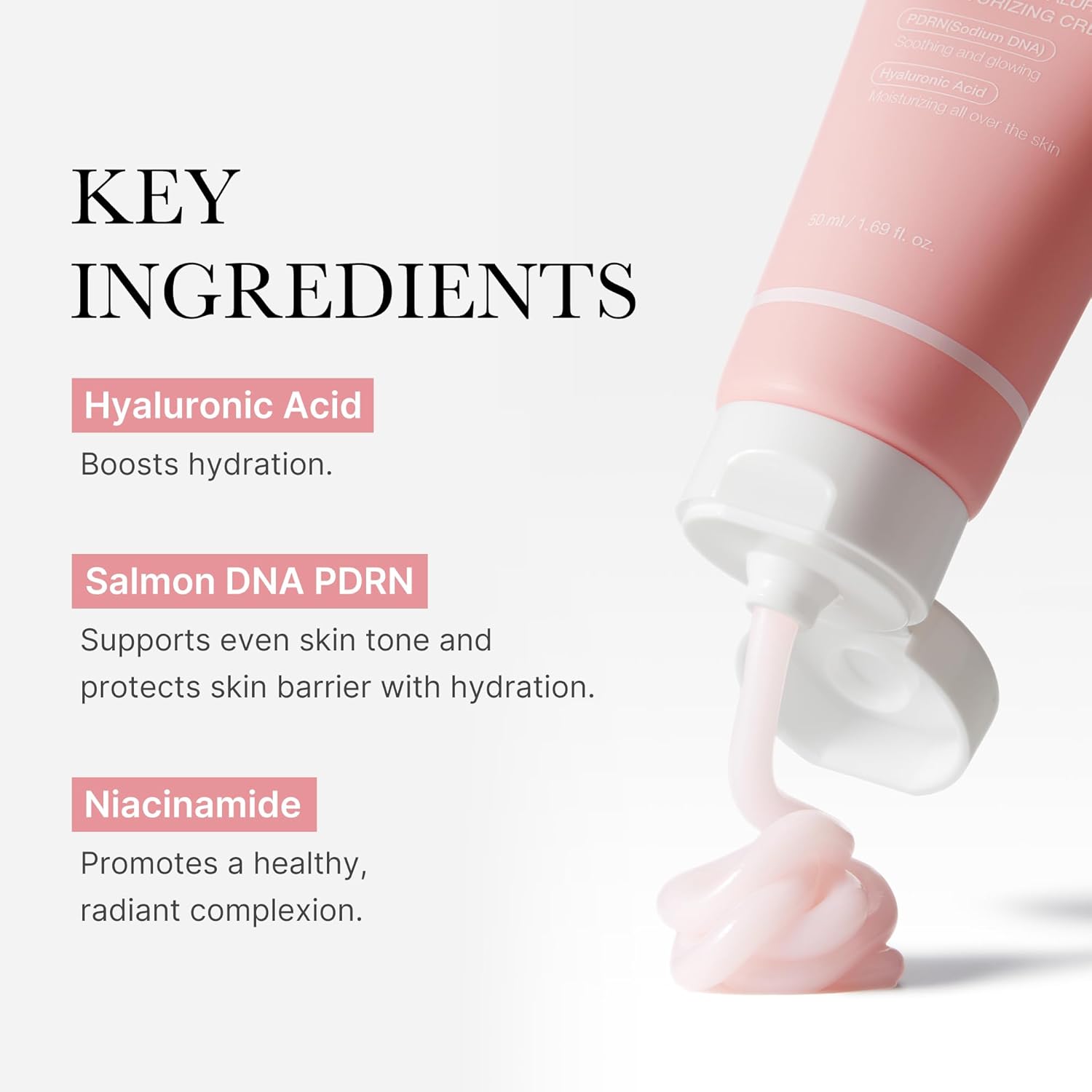 Cosmetic tube with pink cream being squeezed, featuring key ingredients on a white background.