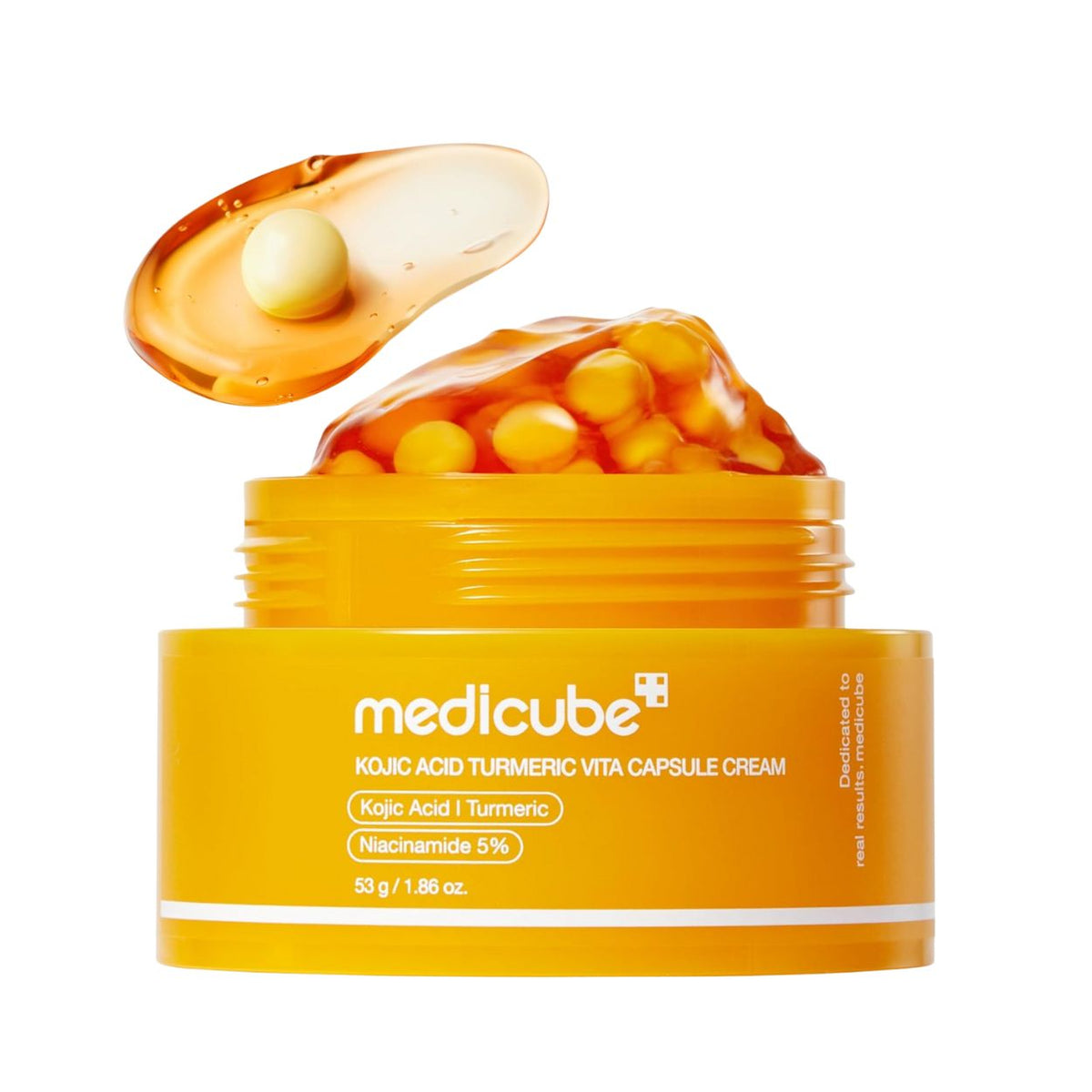Yellow jar of Medicube skincare cream with capsules on a white background